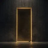 A tall concrete doorway sealed shut, its edges glowing gold in a dark hall